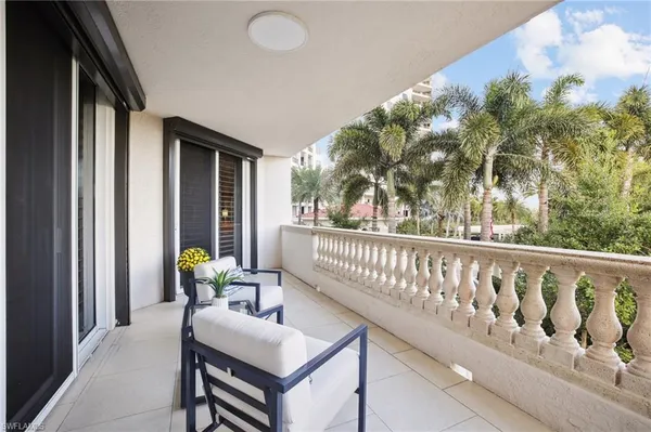 a view of balcony with furniture