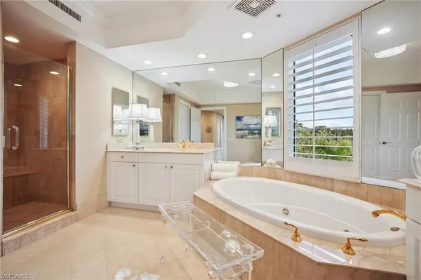 a bathroom with a bathtub and a sink