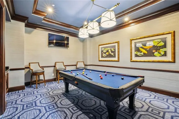 a view of a room with table and chairs