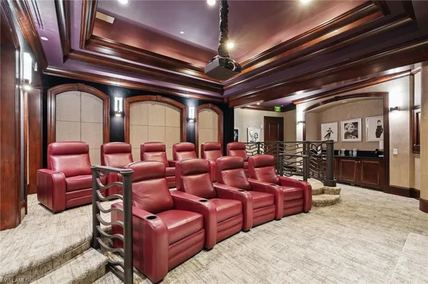 a media room with lots of chairs and a projector screen