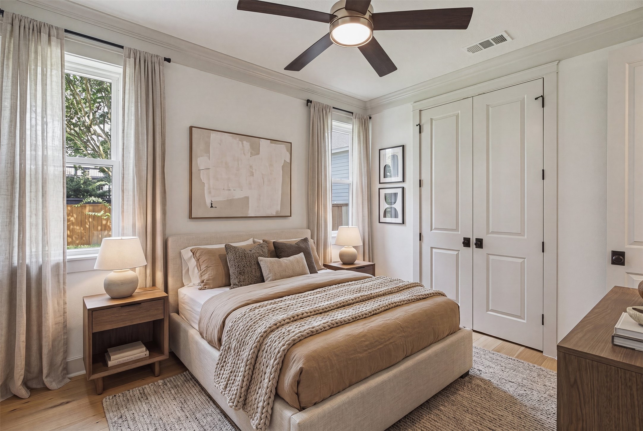 1535 Rutland Street Houston, TX 77008 - Photo 28 of 50 a bedroom with a large bed and a chandelier