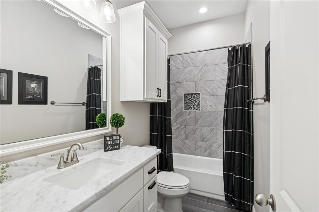 112 Friendship Way Boyd, TX 76023 - Photo 20 of 29 Bathroom featuring a white vanity with a rectangular undermount sink and a light-toned countertop