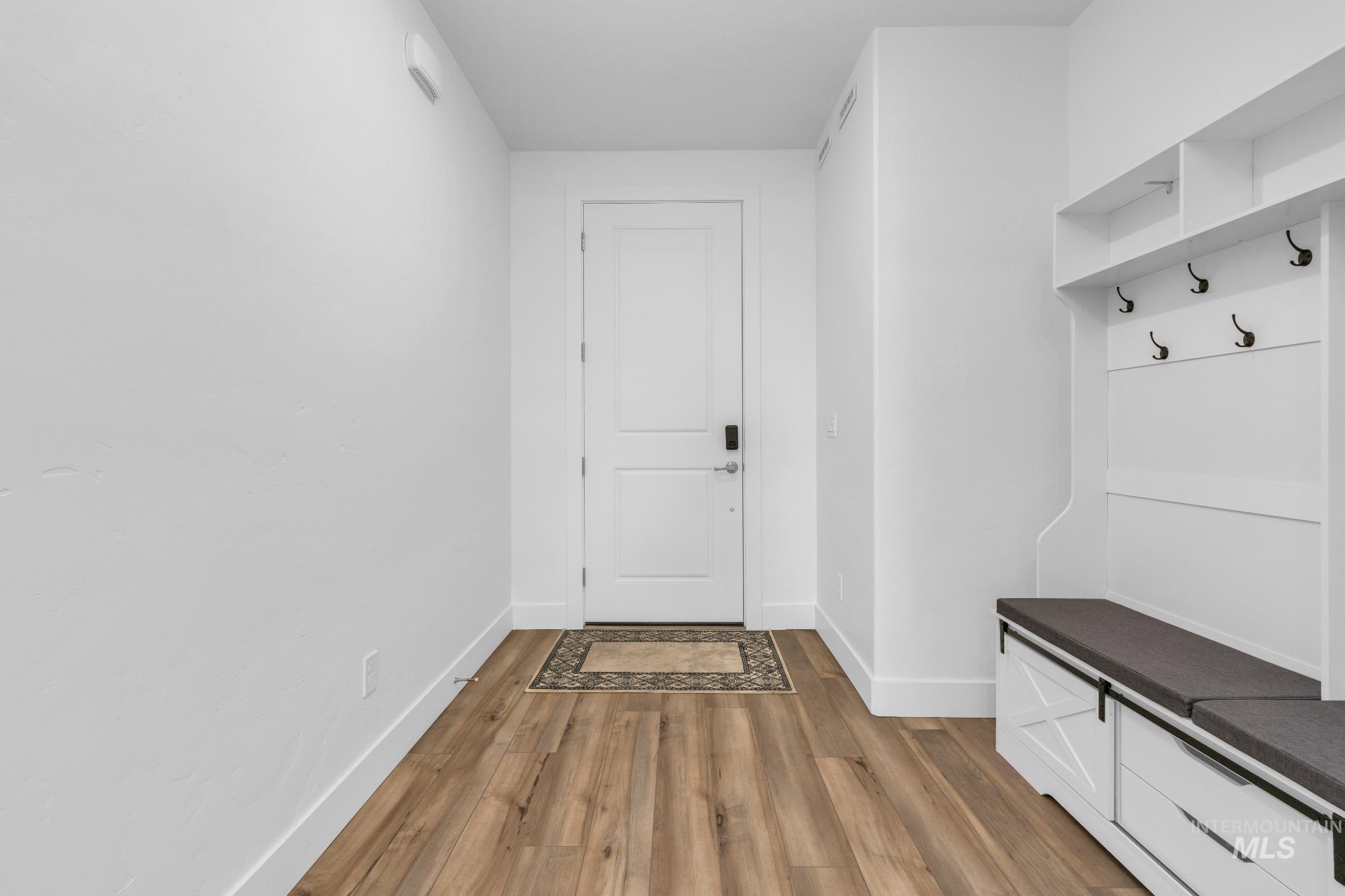 20430 Pitkin Way Caldwell, ID 83605 - Photo 11 of 23 Mudroom featuring light wood-style floors and baseboards