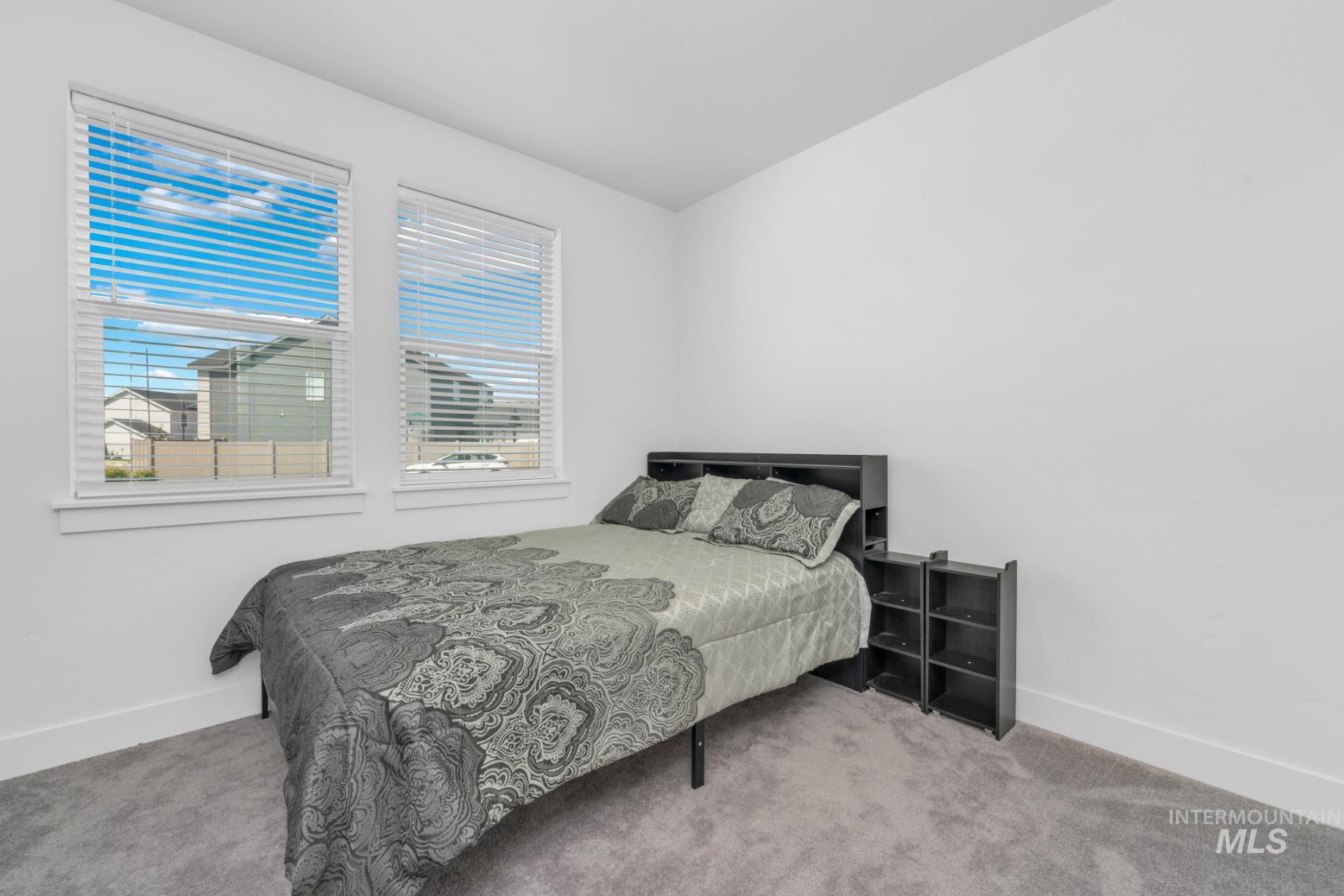 20430 Pitkin Way Caldwell, ID 83605 - Photo 10 of 23 Carpeted bedroom featuring baseboards
