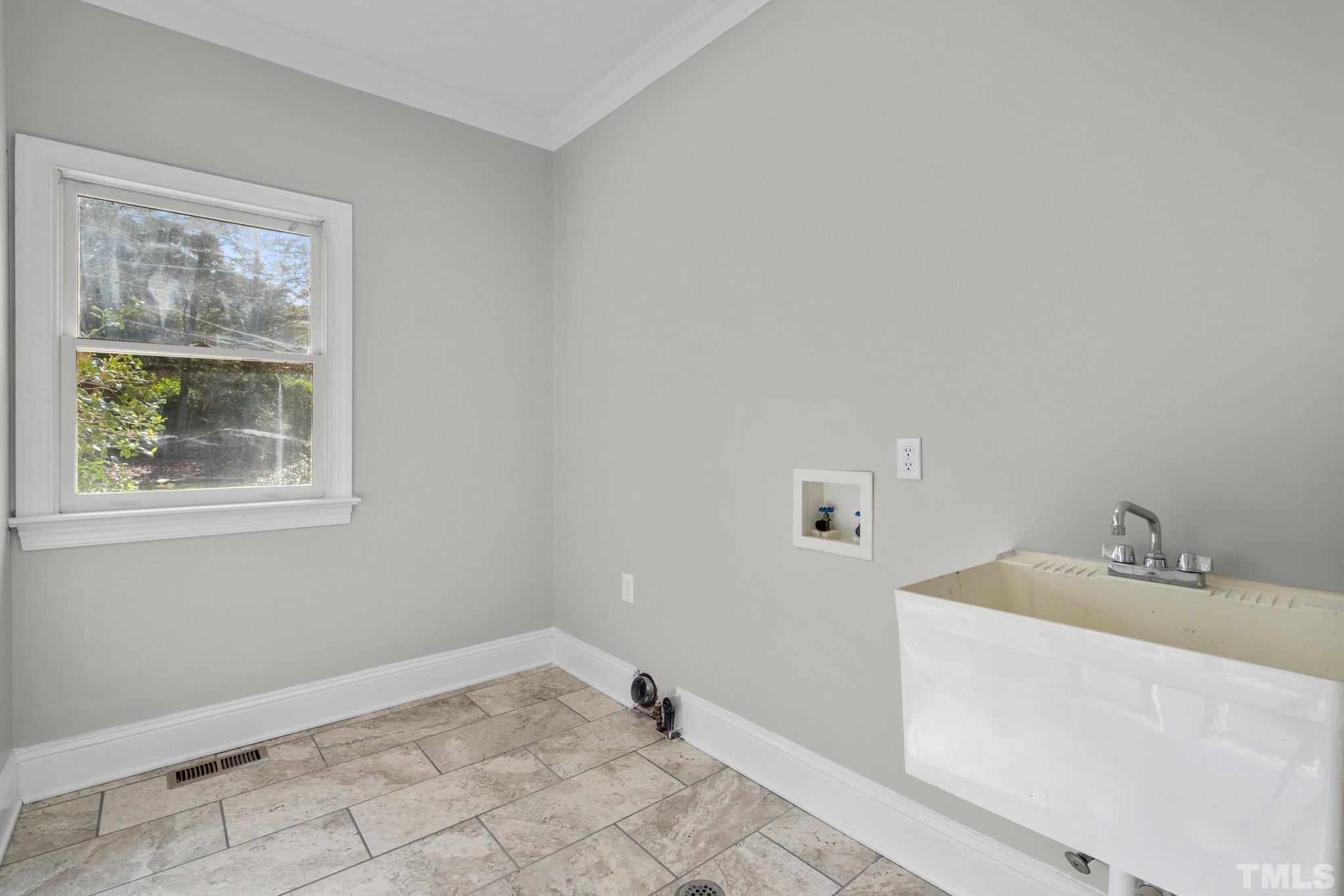 633 Pendleton Lake Road Raleigh, NC 27614 - Photo 11 of 56 a bathroom with a sink and a window