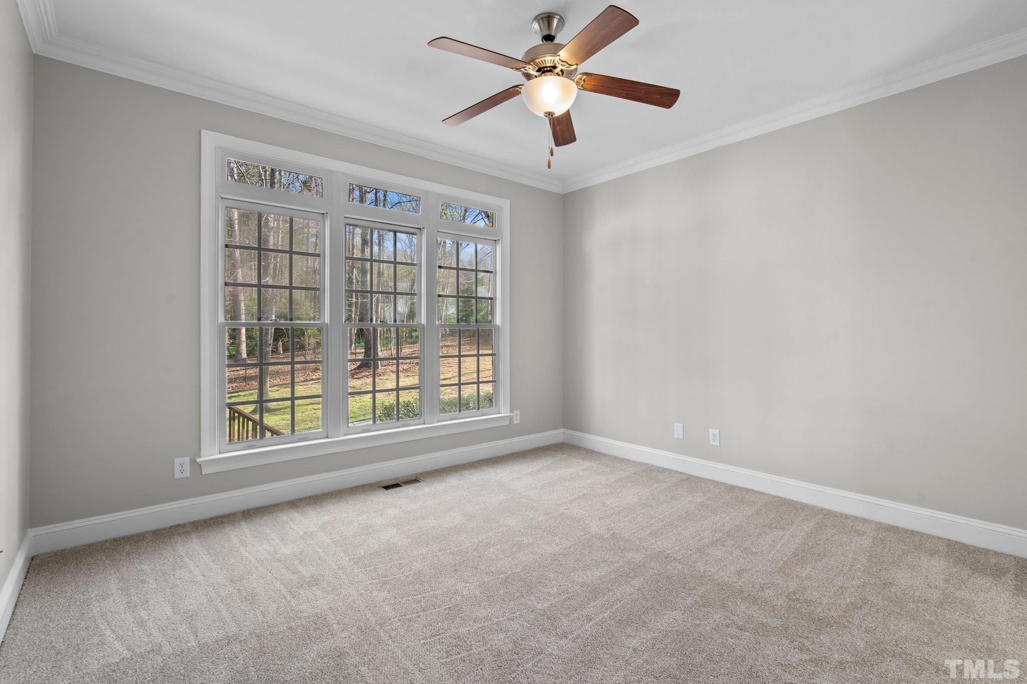 633 Pendleton Lake Road Raleigh, NC 27614 - Photo 12 of 56 a view of an empty room with a window