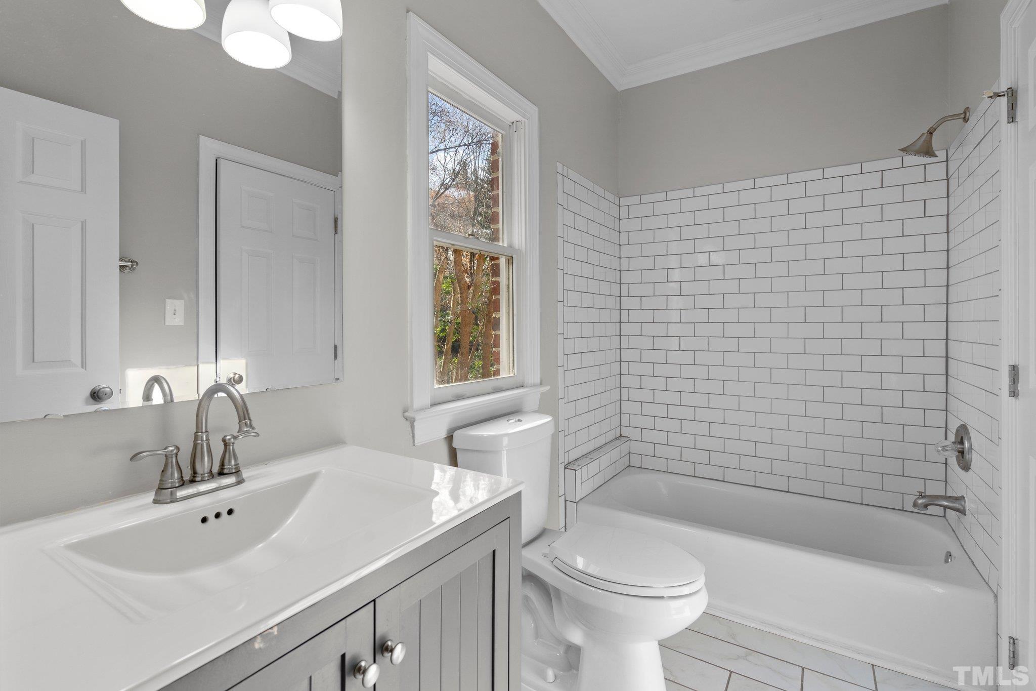 633 Pendleton Lake Road Raleigh, NC 27614 - Photo 14 of 56 a bathroom with a sink a toilet and shower