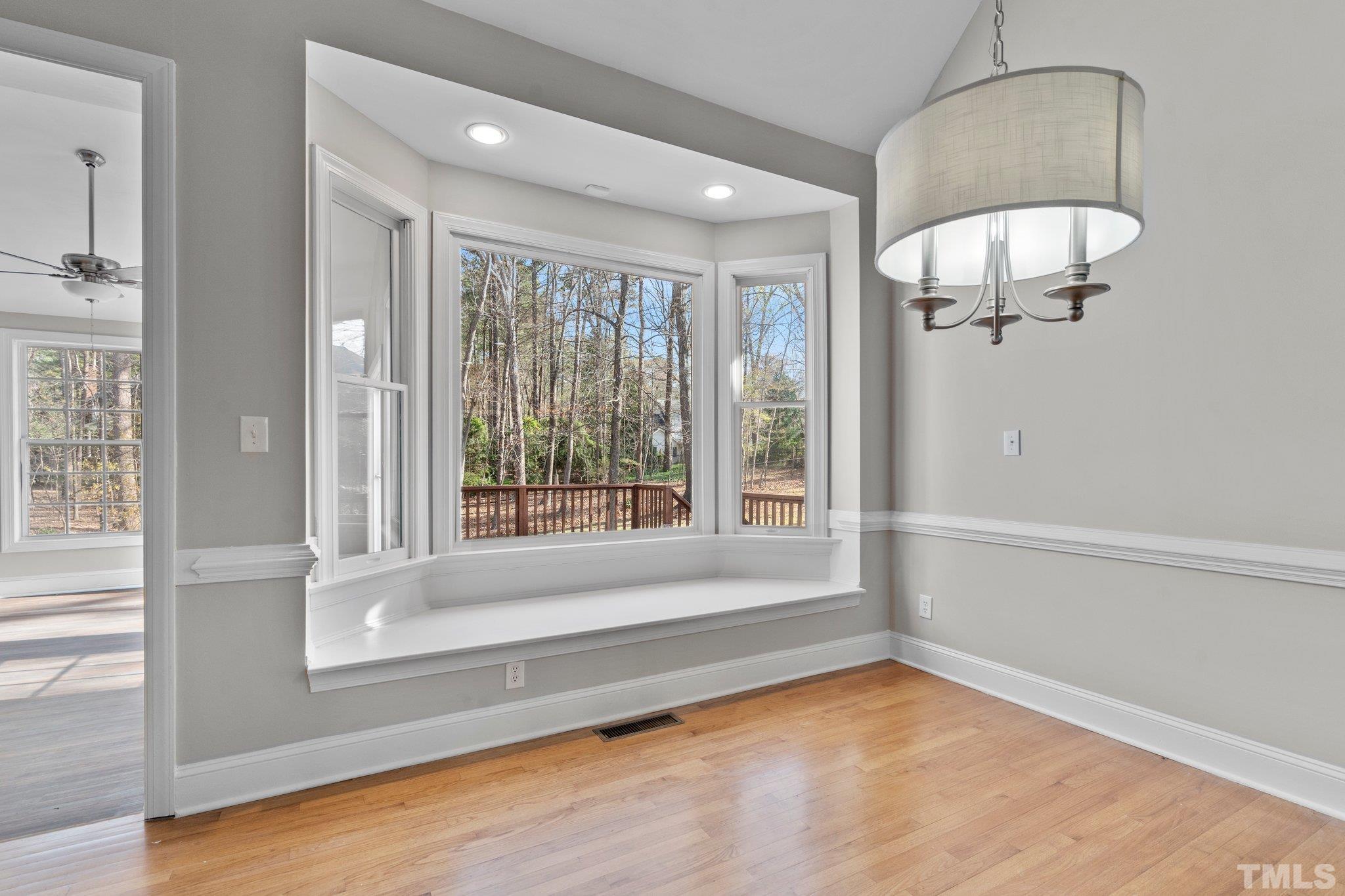 633 Pendleton Lake Road Raleigh, NC 27614 - Photo 15 of 56 a bathroom with a large window and a bath tub