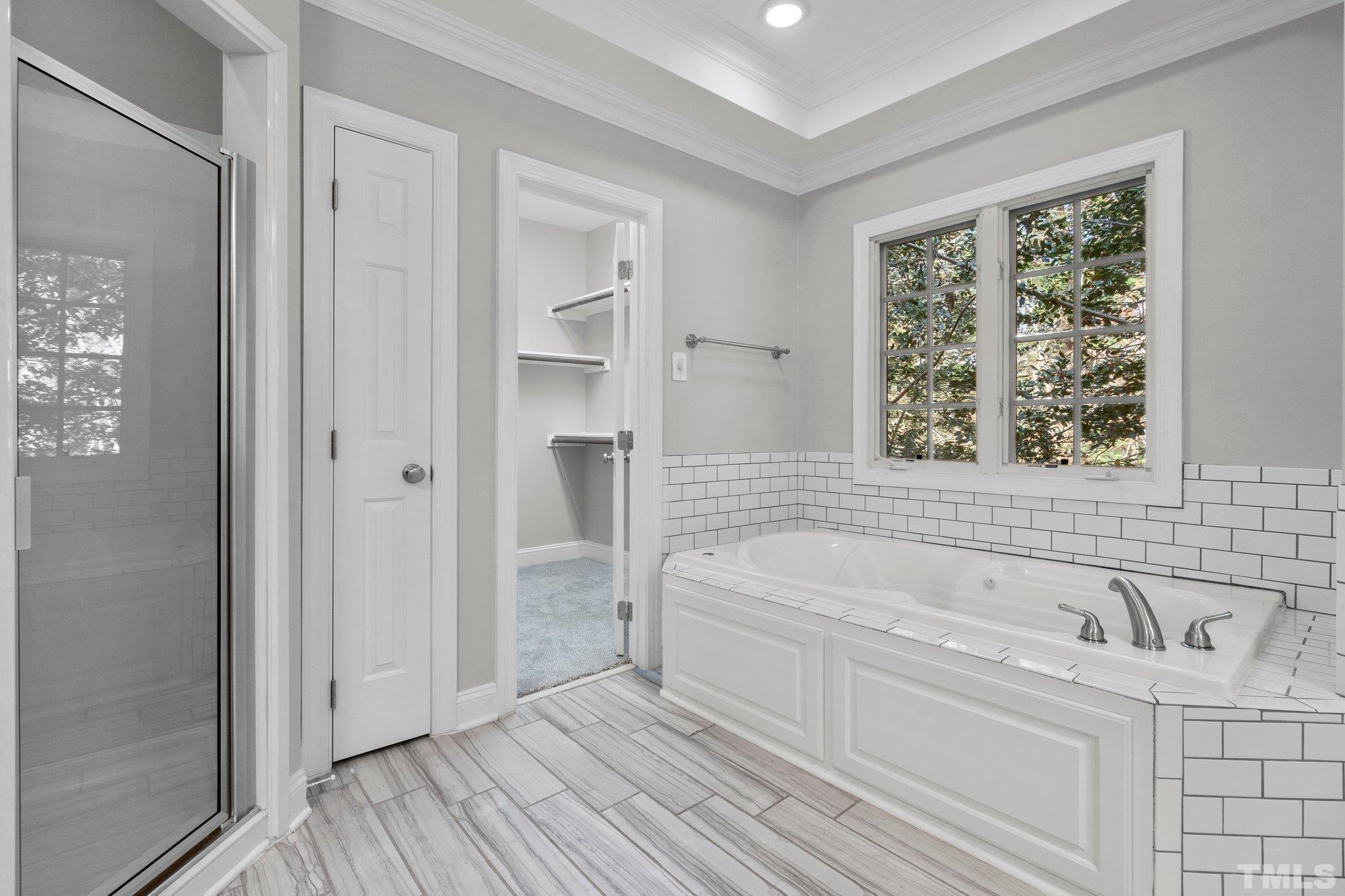 633 Pendleton Lake Road Raleigh, NC 27614 - Photo 20 of 56 a bathroom with a bathtub and a sink