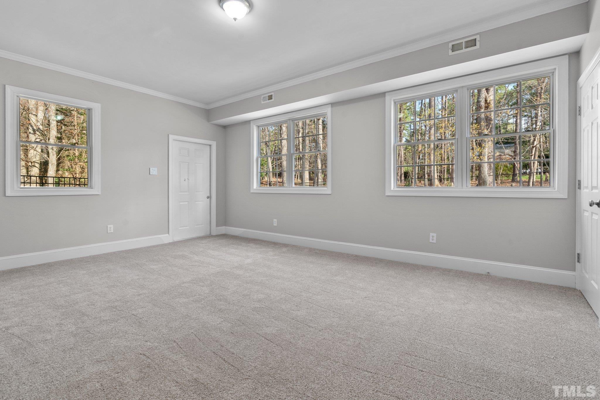 633 Pendleton Lake Road Raleigh, NC 27614 - Photo 23 of 56 an empty room with windows