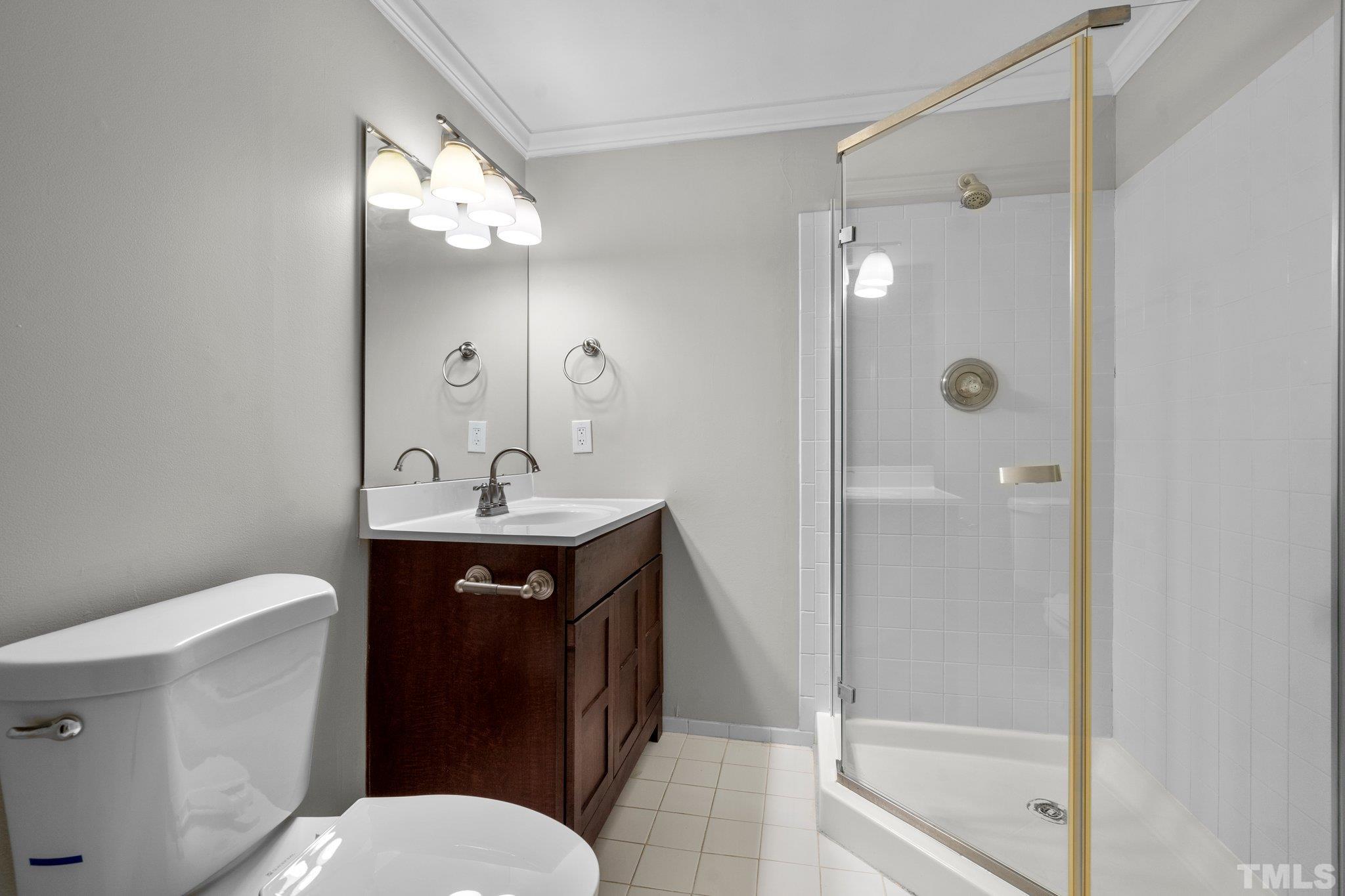 633 Pendleton Lake Road Raleigh, NC 27614 - Photo 24 of 56 a bathroom with a sink a toilet and shower
