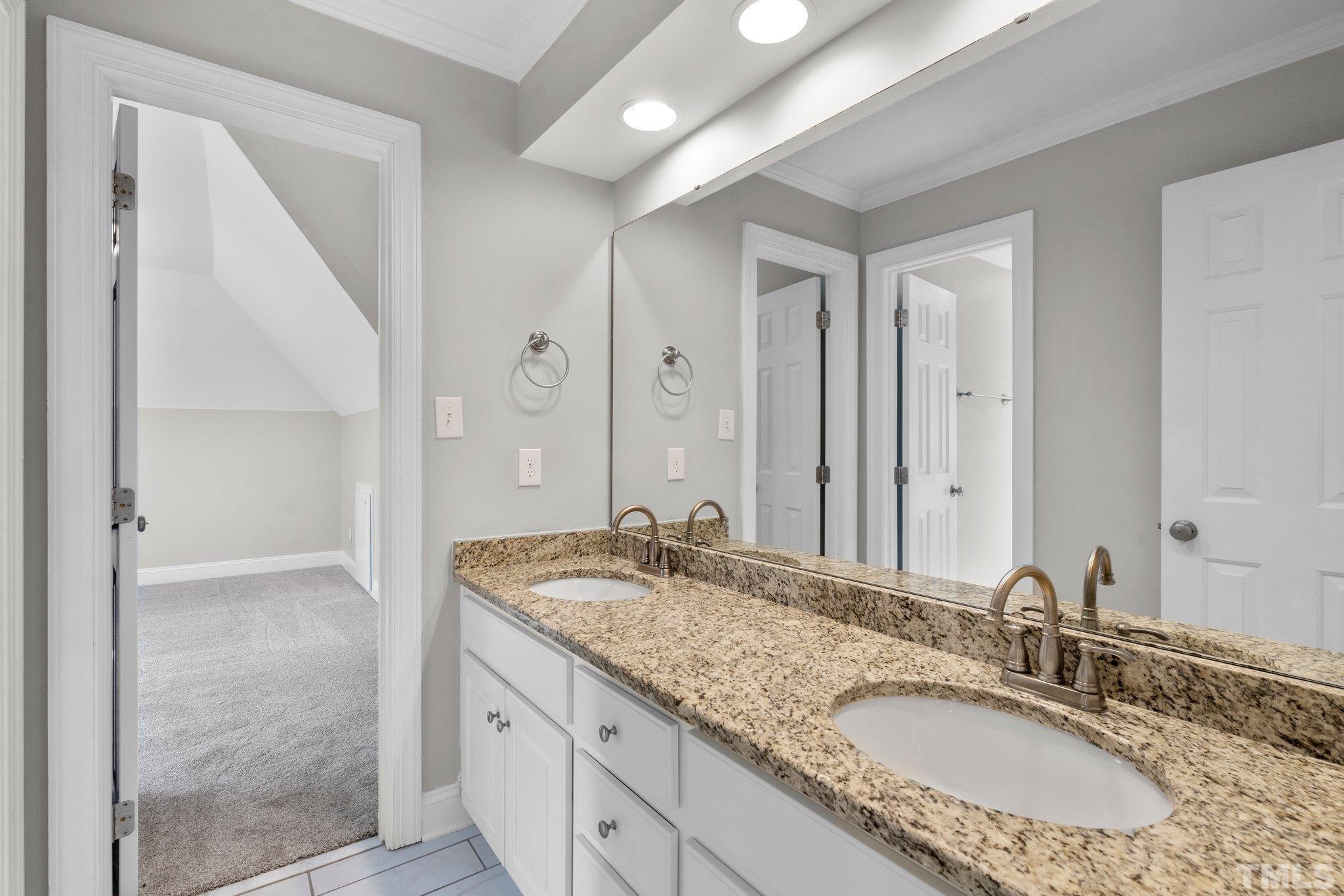 633 Pendleton Lake Road Raleigh, NC 27614 - Photo 27 of 56 a bathroom with a granite countertop double vanity sink and a mirror