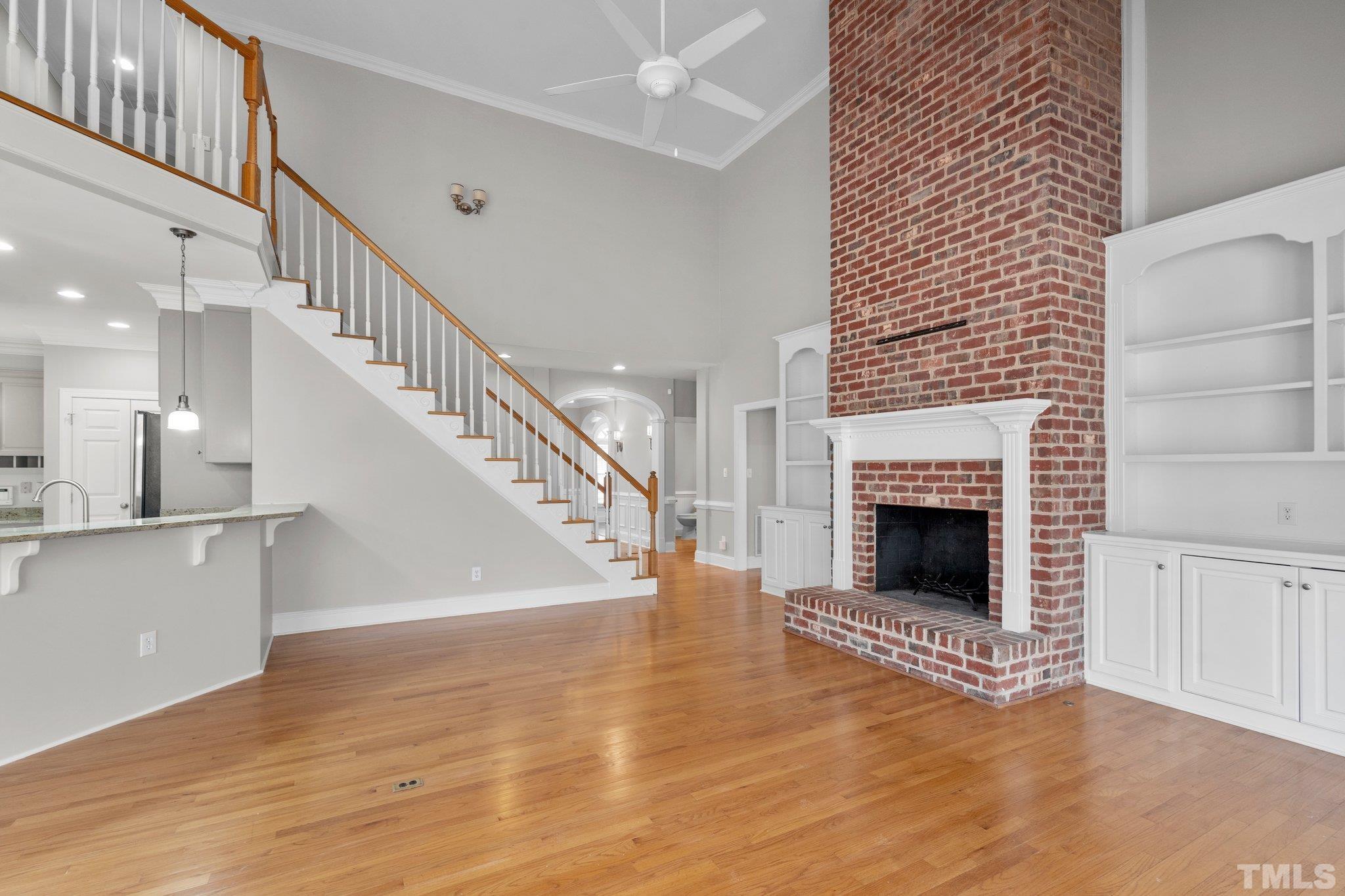 633 Pendleton Lake Road Raleigh, NC 27614 - Photo 33 of 56 a view of an empty room and wooden floor fire place