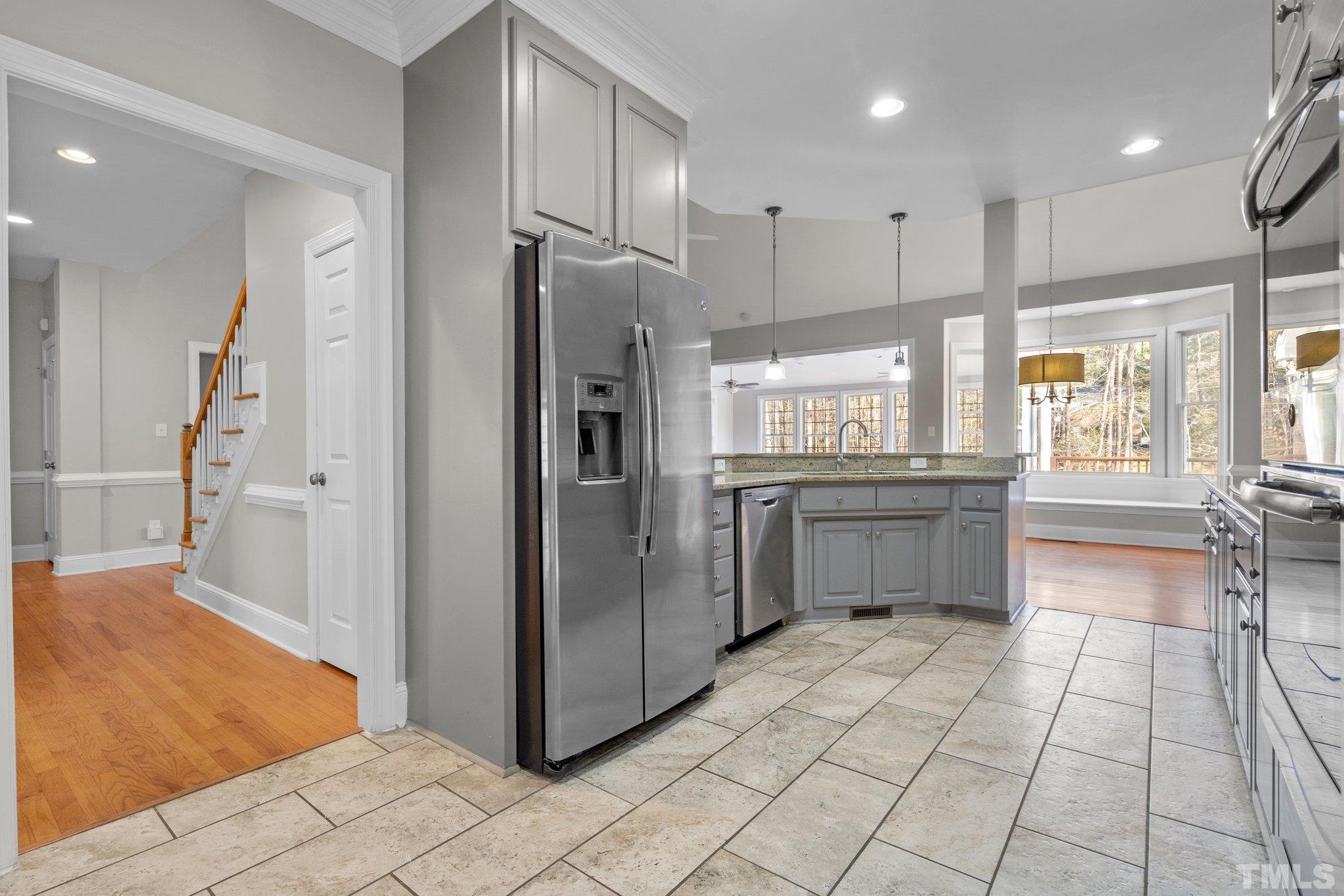 633 Pendleton Lake Road Raleigh, NC 27614 - Photo 36 of 56 a kitchen with stainless steel appliances a refrigerator and a sink