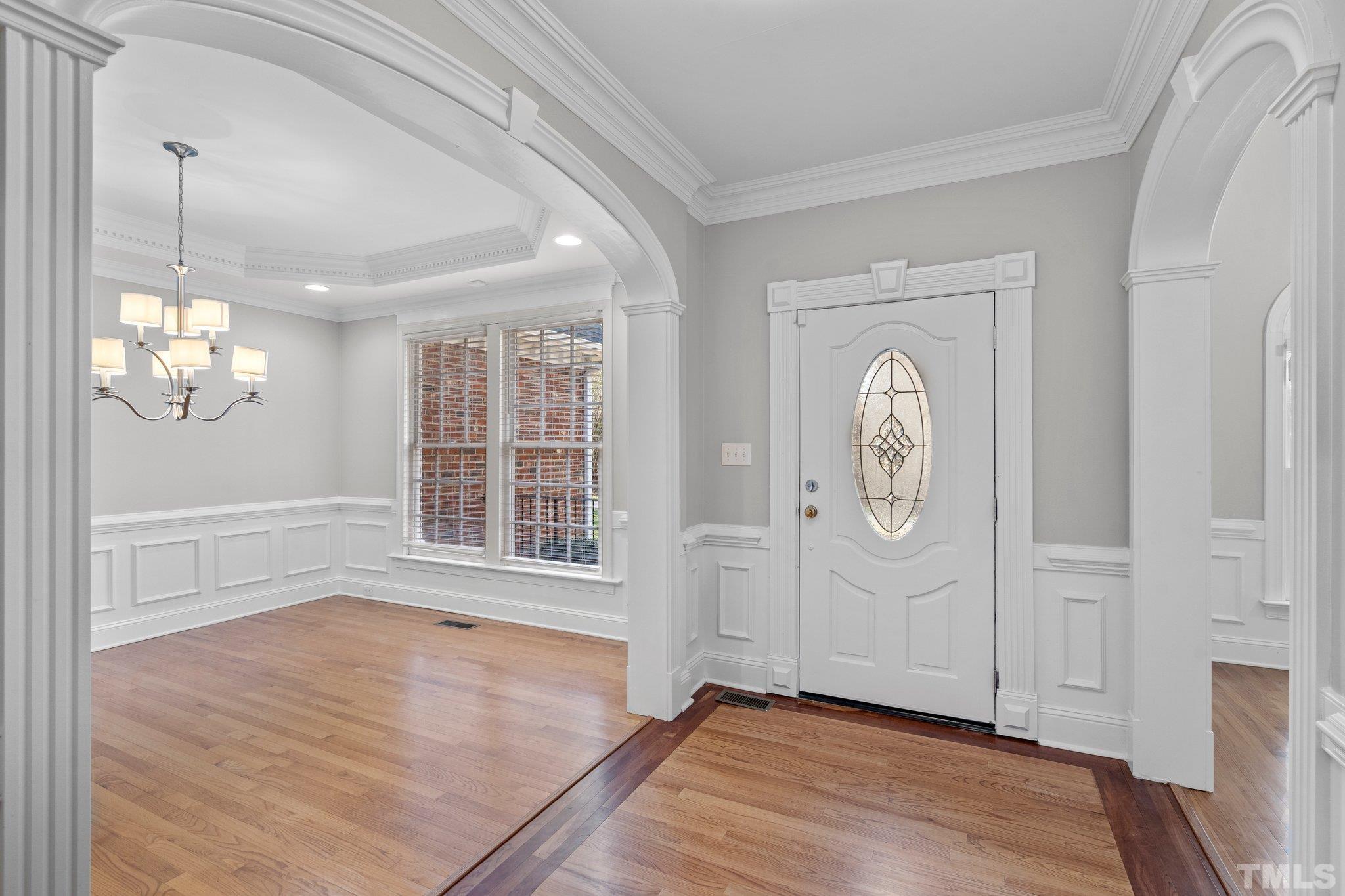 633 Pendleton Lake Road Raleigh, NC 27614 - Photo 4 of 56 an empty room with wooden floor and windows