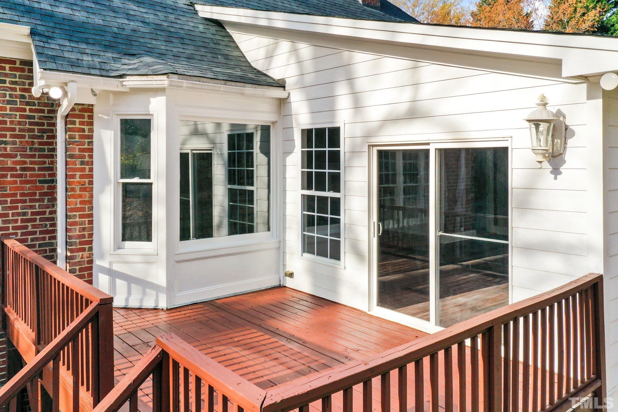 633 Pendleton Lake Road Raleigh, NC 27614 - Photo 44 of 56 a view of a balcony with a barbeque