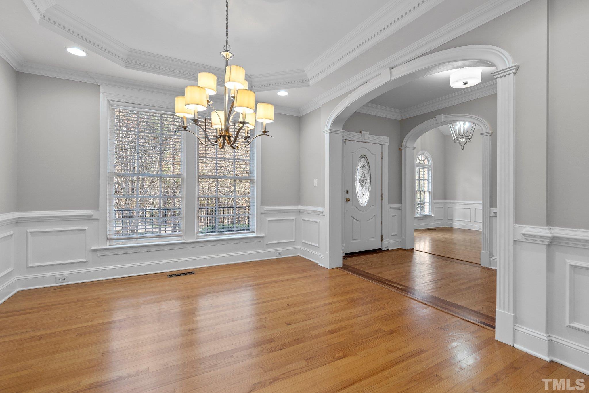 633 Pendleton Lake Road Raleigh, NC 27614 - Photo 5 of 56 a view of an empty room with wooden floor and a window