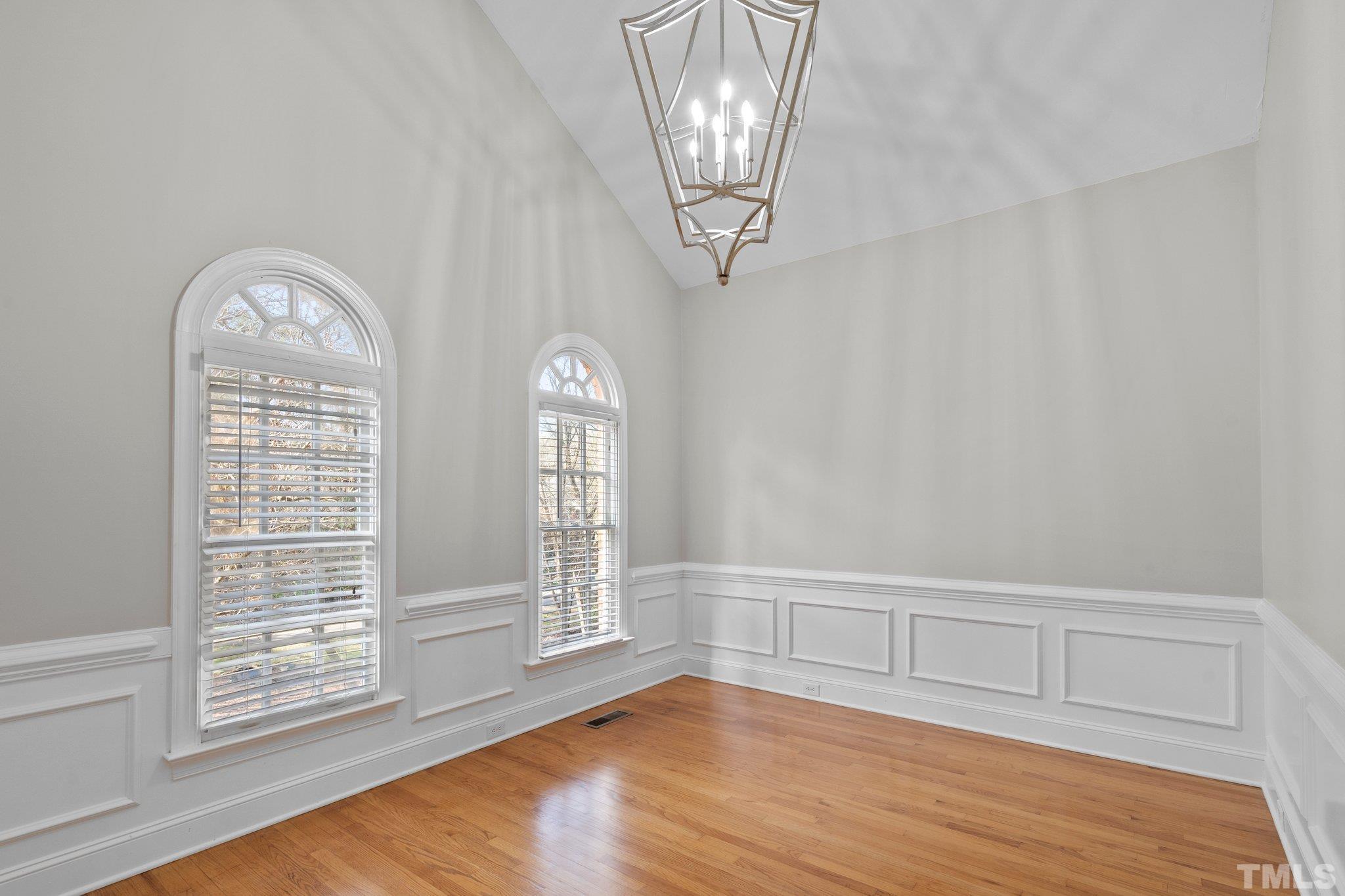 633 Pendleton Lake Road Raleigh, NC 27614 - Photo 6 of 56 a view of empty room with wooden floor and fan