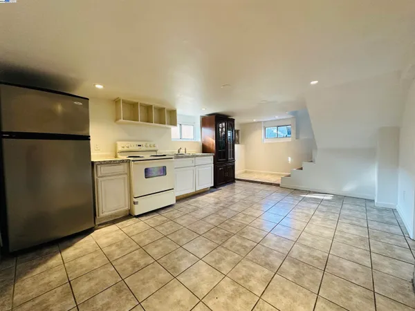 a kitchen with stainless steel appliances a refrigerator and a stove