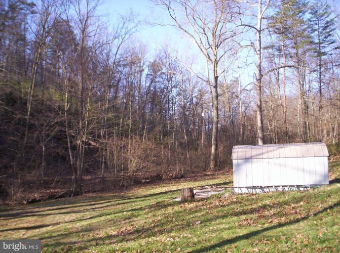 520 Packing Shed Road Berkeley Springs, WV 25411 - Photo 6 of 11 a view of a tiny house with a yard