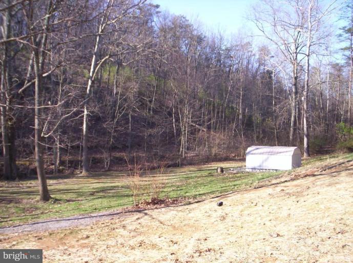 520 Packing Shed Road Berkeley Springs, WV 25411 - Photo 9 of 11 a view of a swimming pool with an outdoor space