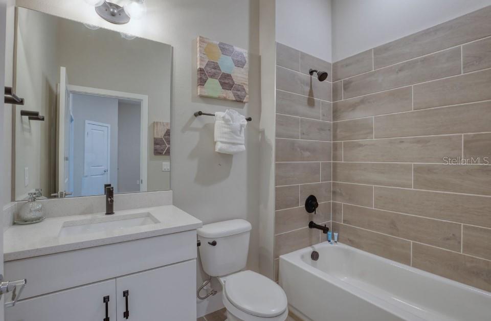 2116 Broome Street Kissimmee, FL 34743 - Photo 13 of 16 a bathroom with a sink toilet and shower