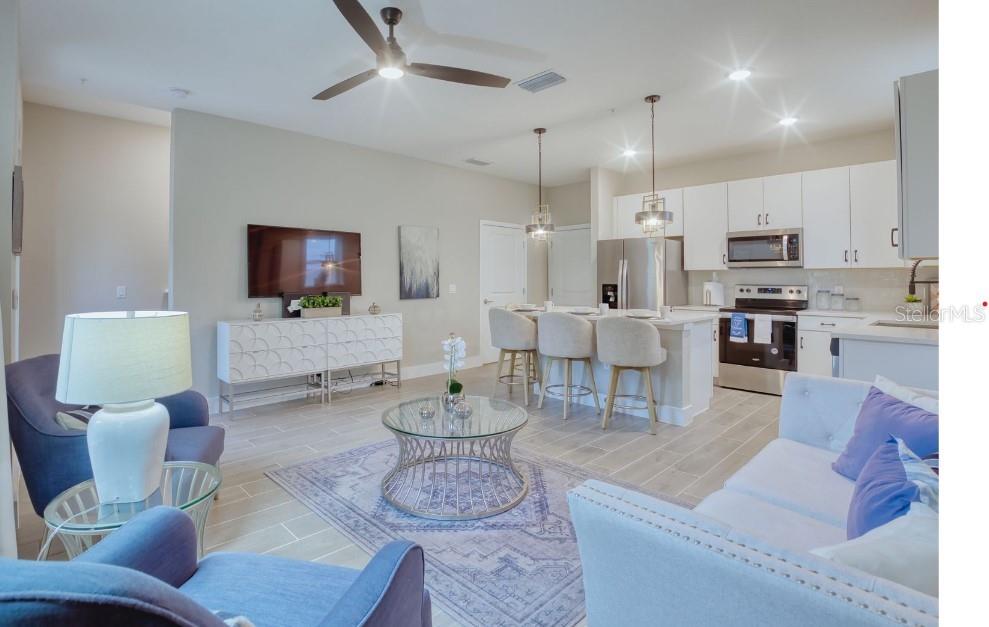 2116 Broome Street Kissimmee, FL 34743 - Photo 4 of 16 a living room with furniture and a flat screen tv