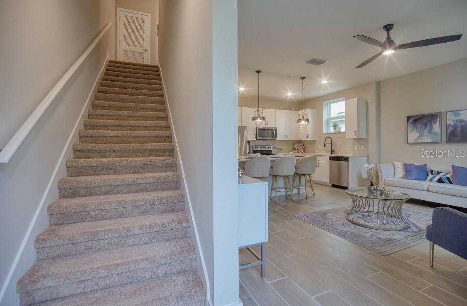 2116 Broome Street Kissimmee, FL 34743 - Photo 7 of 16 a living room with furniture and a view of entryway