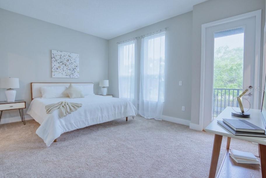 2116 Broome Street Kissimmee, FL 34743 - Photo 8 of 16 a bedroom with a bed and a window