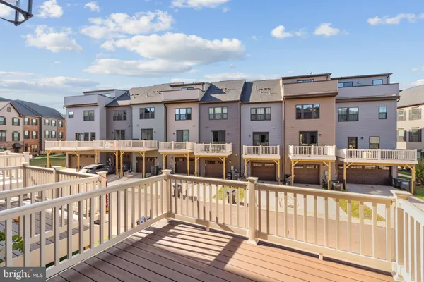 a view of a brick building next to a yard