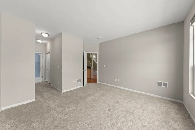 a view of an empty room and closet area