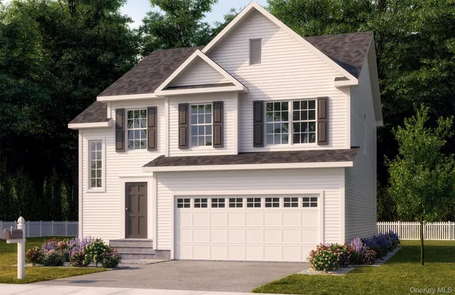 a view of a white house with a yard and plants