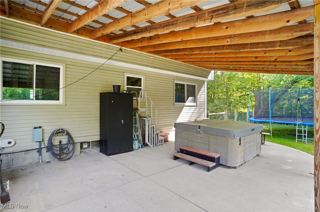 15575 Stillwell Road Huntsburg, OH 44046 - Photo 39 of 48 View of patio / terrace featuring a trampoline