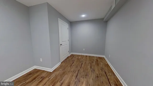 a view of balcony with wooden floor