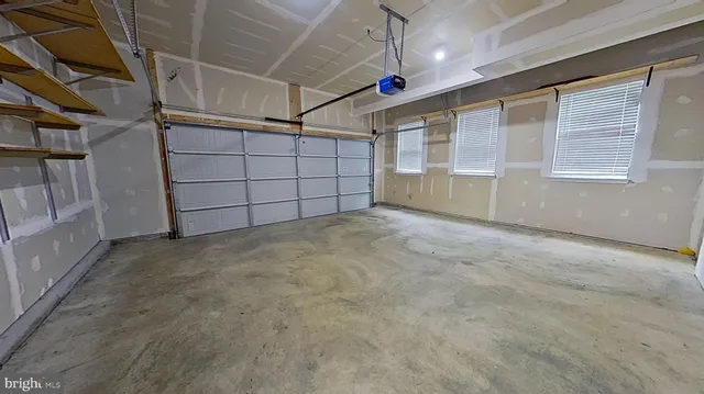 a view of a house with wooden deck