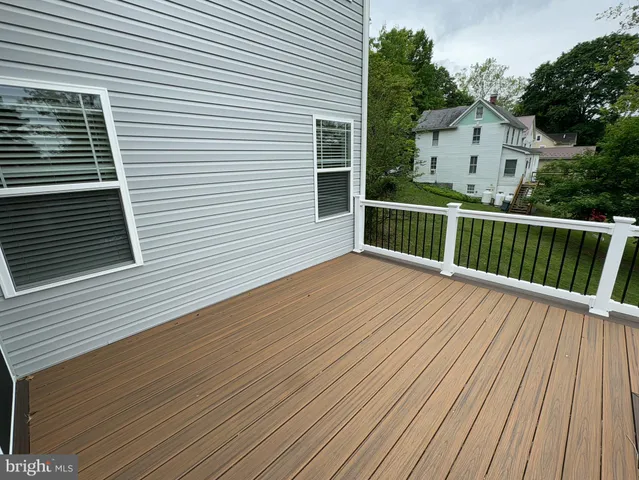a view of a balcony with wooden floor