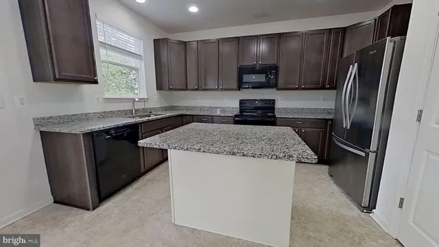 a white toilet sitting next to a shower