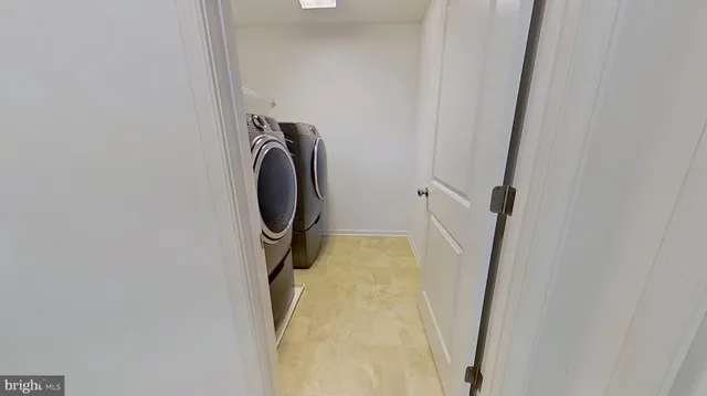 an empty room with a ceiling fan and windows