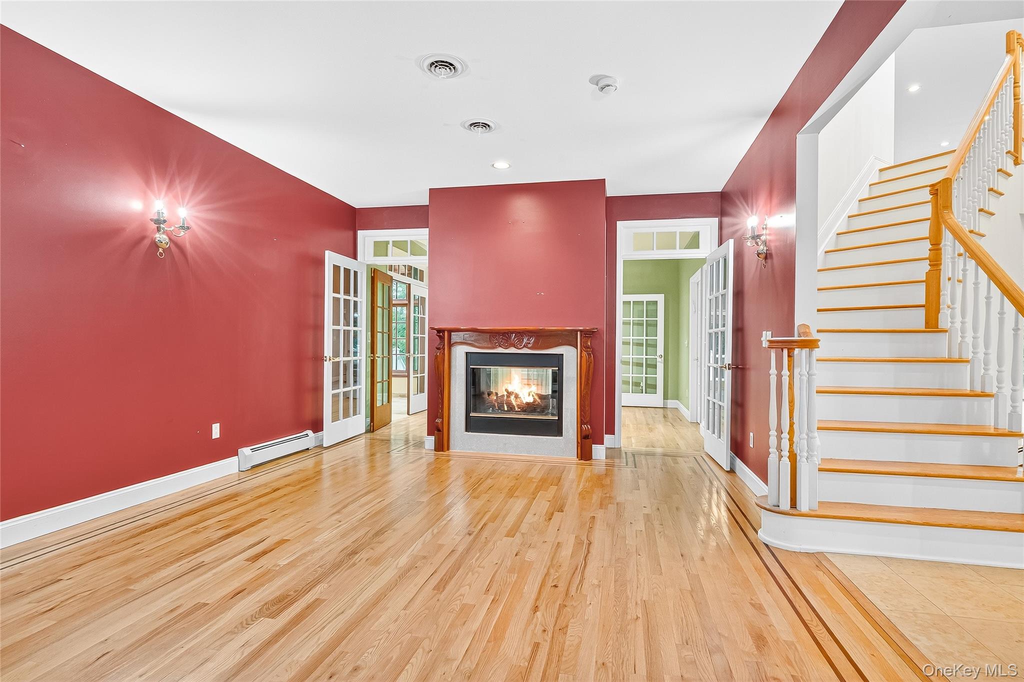 21 Bensons Point Court Stony Point, NY 10980 - Photo 11 of 50 a view of an empty room with wooden floor fireplace and a window