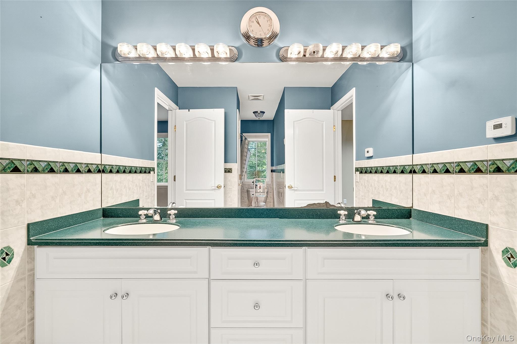 21 Bensons Point Court Stony Point, NY 10980 - Photo 28 of 50 a bathroom with sinks and a mirror