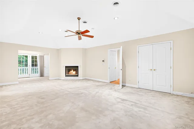 a bathroom with a granite countertop sink and a window