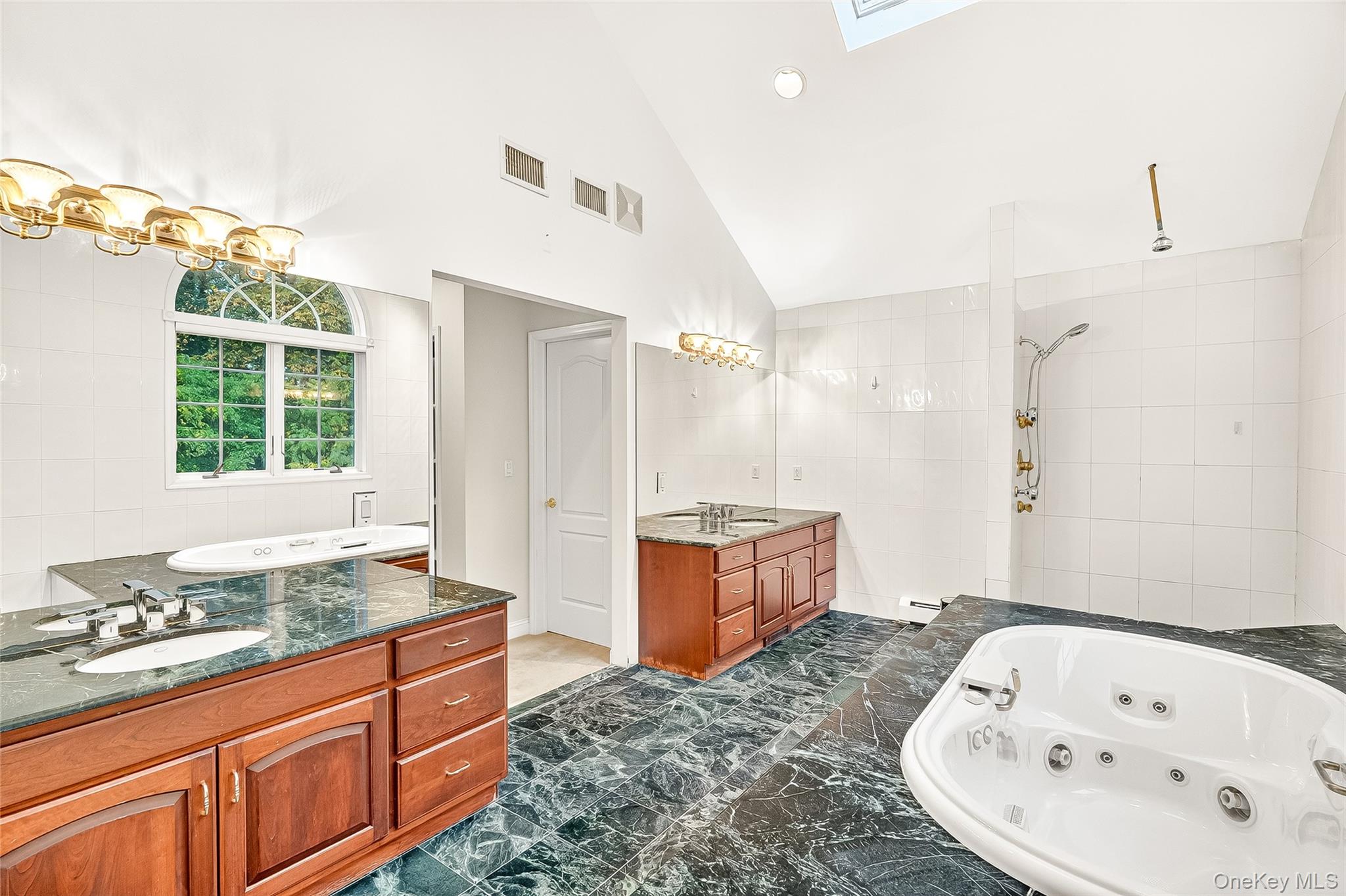 21 Bensons Point Court Stony Point, NY 10980 - Photo 35 of 50 a bathroom with a granite countertop tub sink and mirror
