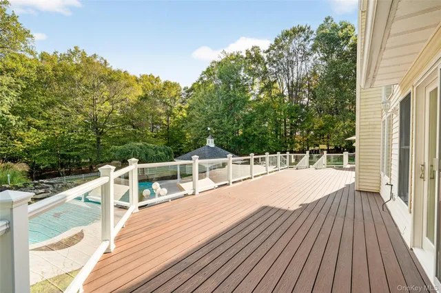 a view of balcony with deck and trees