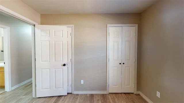 an empty room with wooden floor