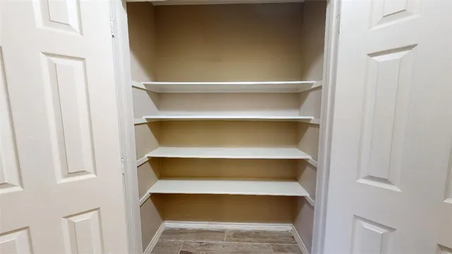 a storage room with wooden floor