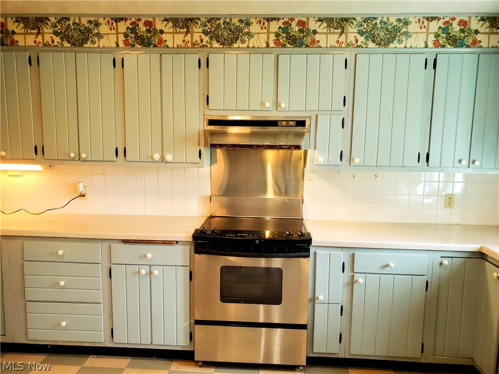 Main stretch of kitchen with newer appliances
