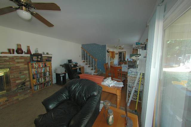13890 Chamy Drive Reno, NV 89521 - Photo 3 of 4 a living room with furniture and a table
