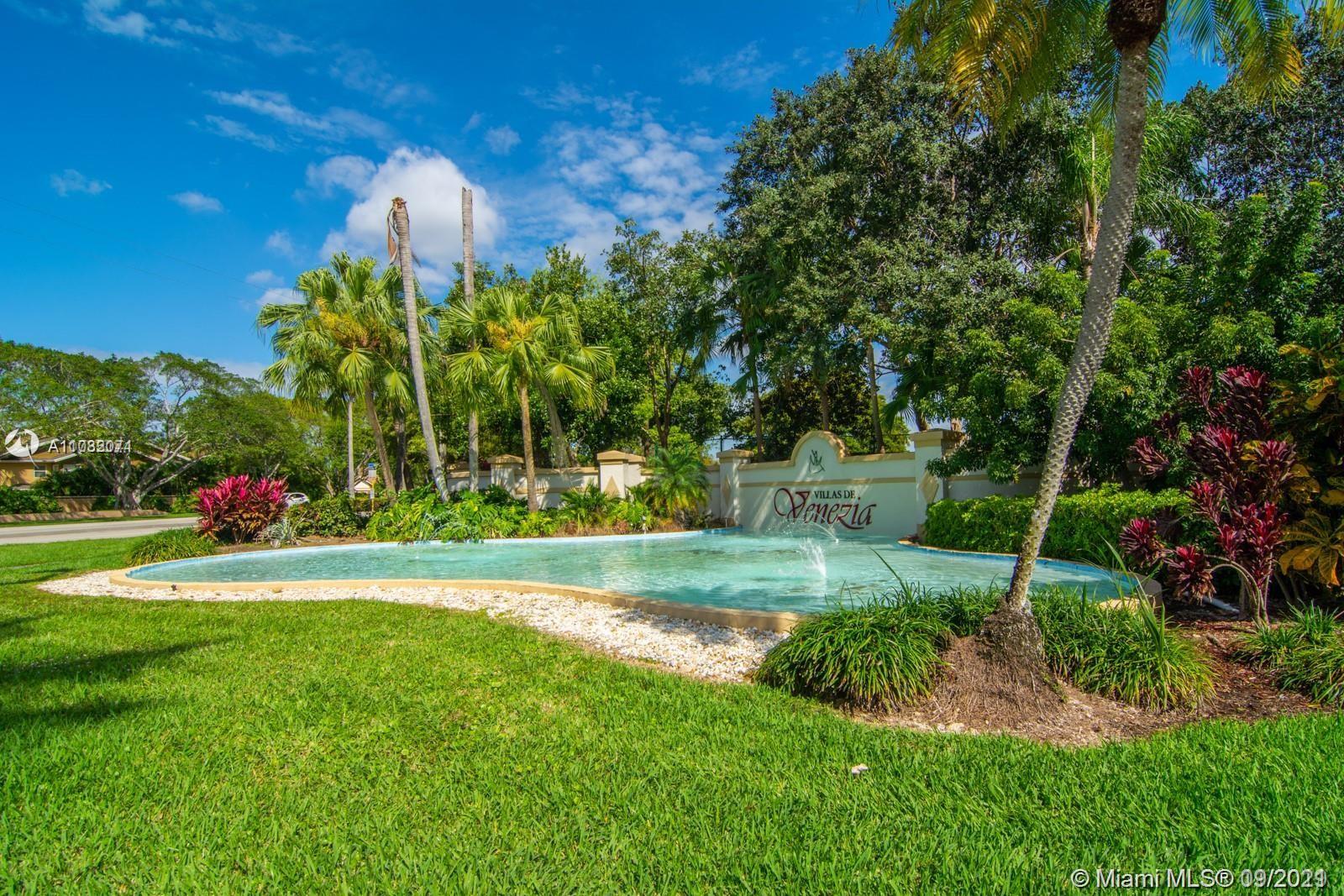a view of a park with large trees
