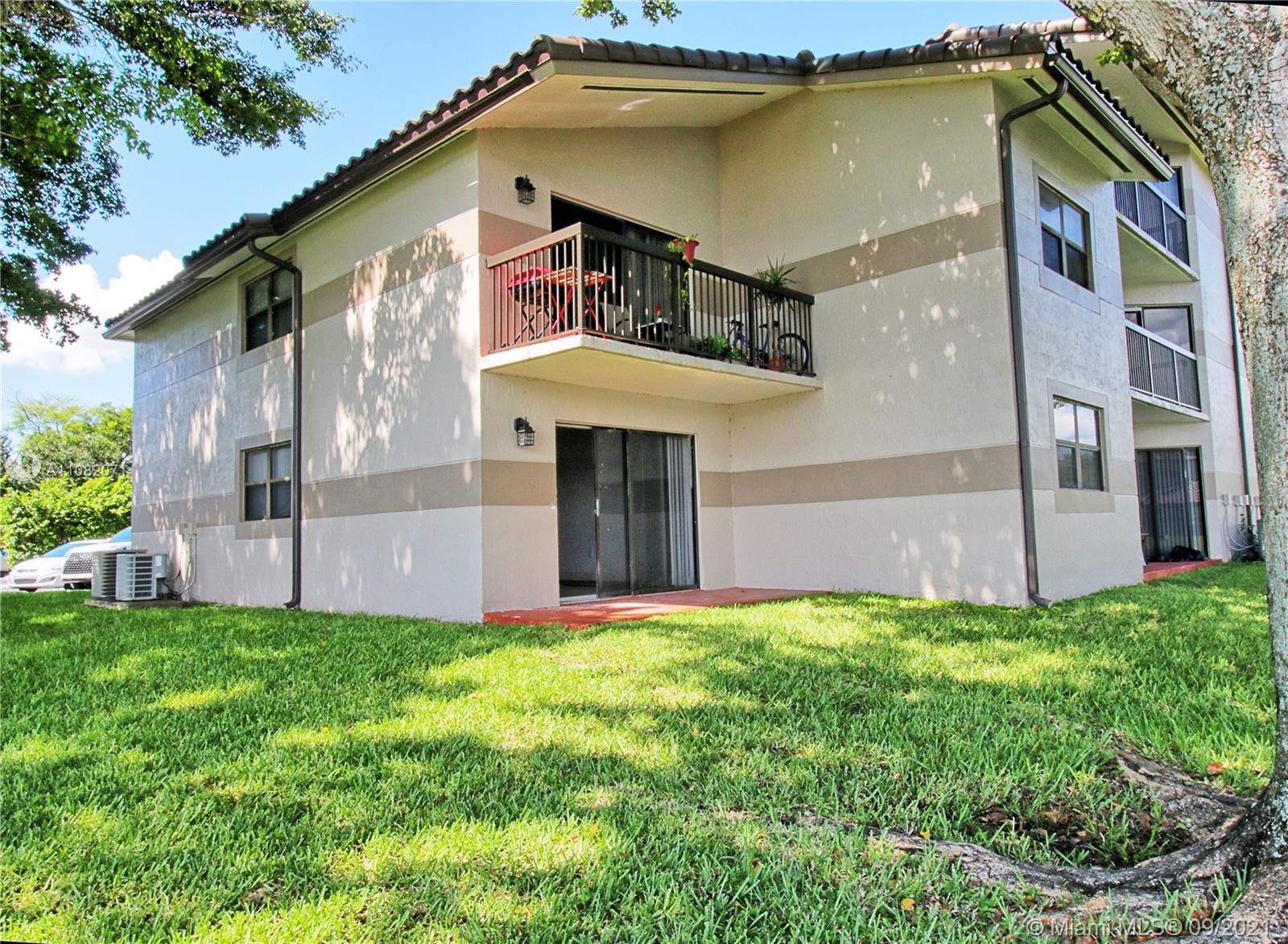 Welleby Sunrise, FL 33351 - Photo 8 of 9 a view of a house with a yard plants and large tree