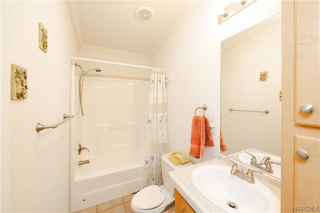 3190 East Pepper Tree Road Kingman, AZ 86409 - Photo 25 of 67 a bathroom with a sink toilet and shower